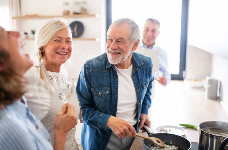 Dentures patient smiling with family